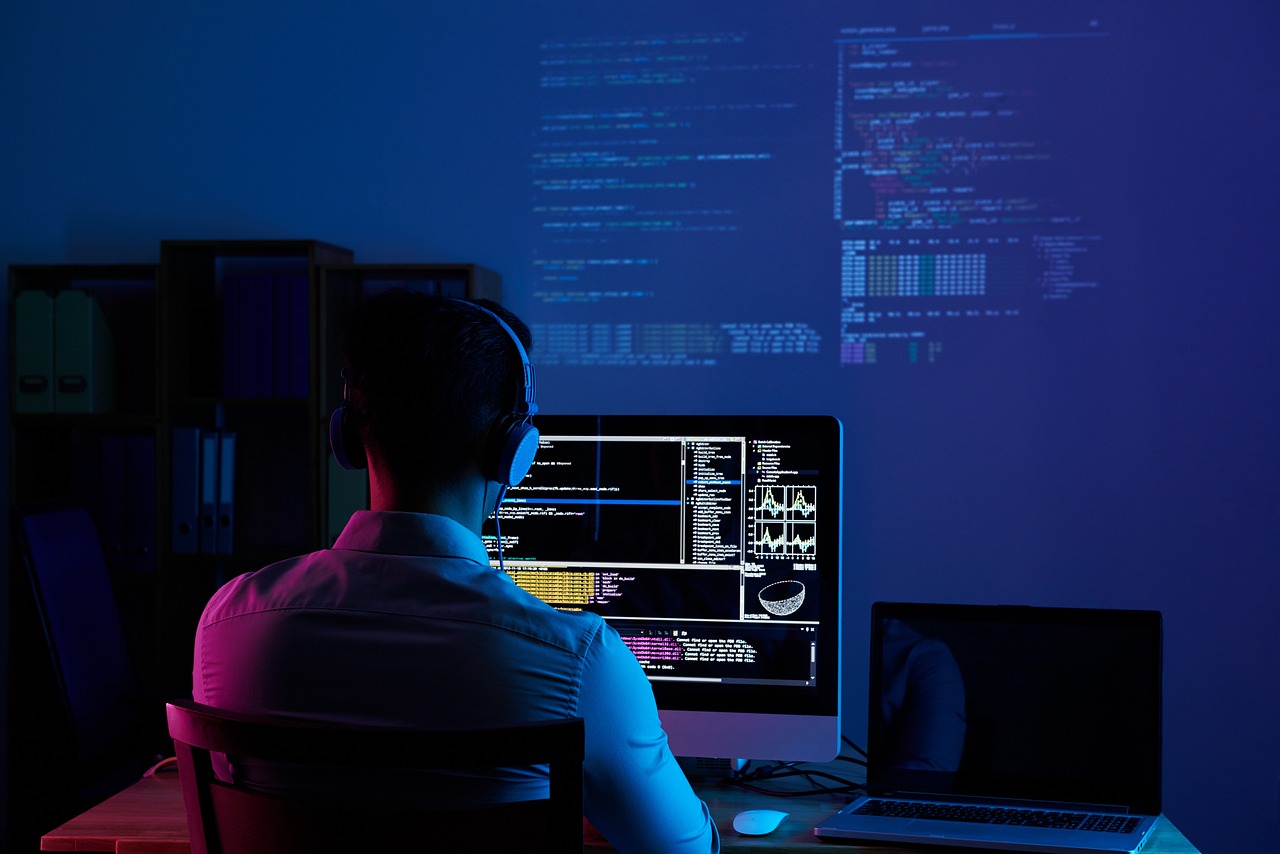 Man who is coding on computer